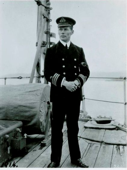 Commander Walter House stands on the deck of his ship, the HMCS Rainbow.